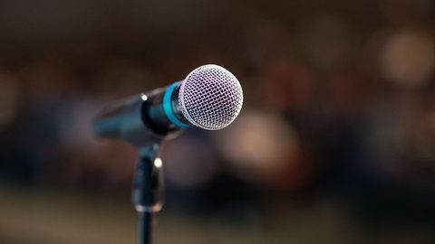Illustrative photo: public speaking, mic, microphone