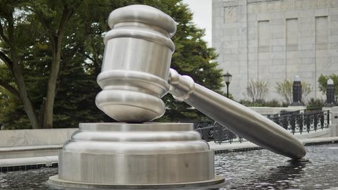 Illustrative photo: gavel statue, pool, at