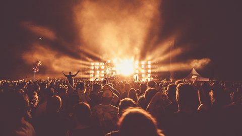Illustrative photo: audience, backlit, concert